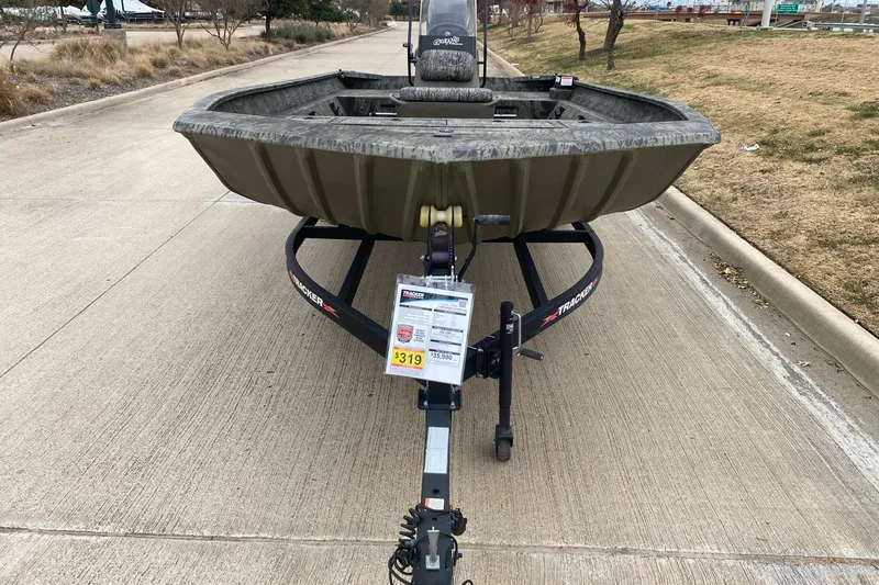 Slide: The Image of 2026 Tracker Grizzly 2072 CC boat on trailer, parked on a concrete road. - 3