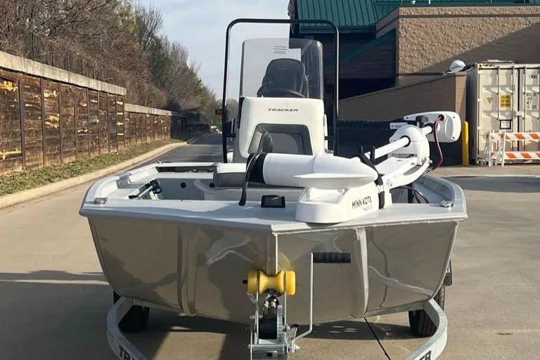 Slide: The Image of 2026 Tracker Bass Tracker Classic CC boat on trailer, parked outdoors. - 2