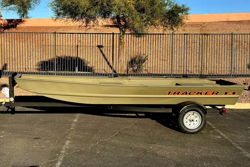 The Image of 2026 Tracker Grizzly 14 Jon boat on trailer, parked outdoors. - 0