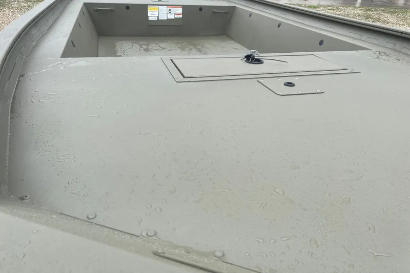 Slide: The Image of 2026 Tracker Grizzly 1754 Utility boat interior with raindrops on surface. - 6