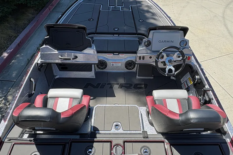Slide: The Image of 2026 Nitro Z19 XL boat interior with Garmin dashboard and dual seats. - 14