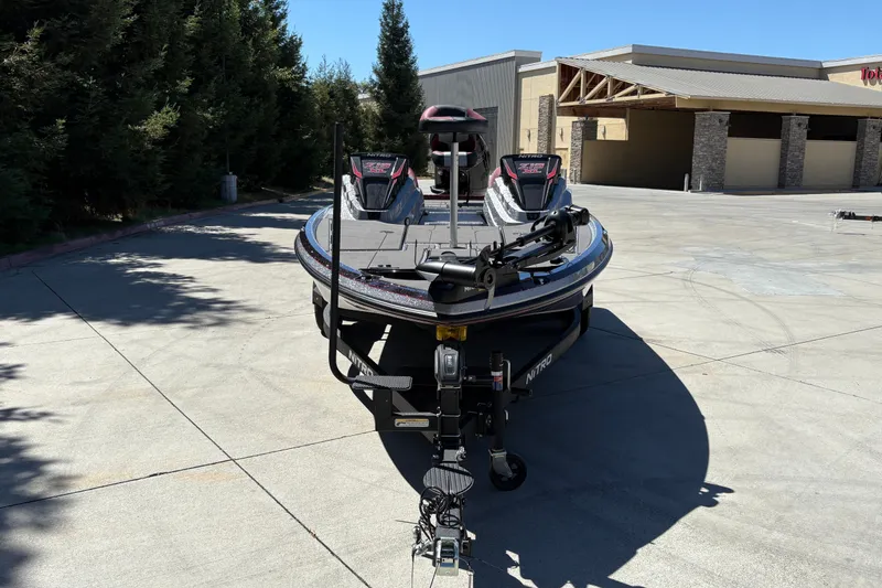 Slide: The Image of 2026 Nitro Z19 XL boat parked outdoors, showcasing sleek design and advanced features. - 11