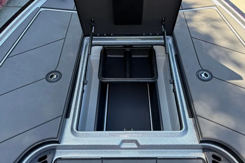 Slide: The Image of Open storage compartment on 2026 Nitro Z19 XL boat deck. - 37