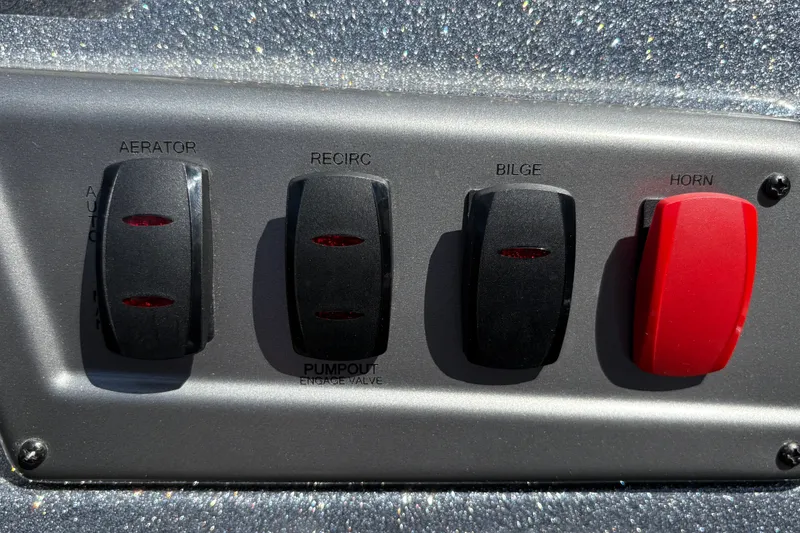 Slide: The Image of Control panel of a 2026 Nitro Z19 XL boat with switches for aerator, recirculation, bilge, and horn. - 32