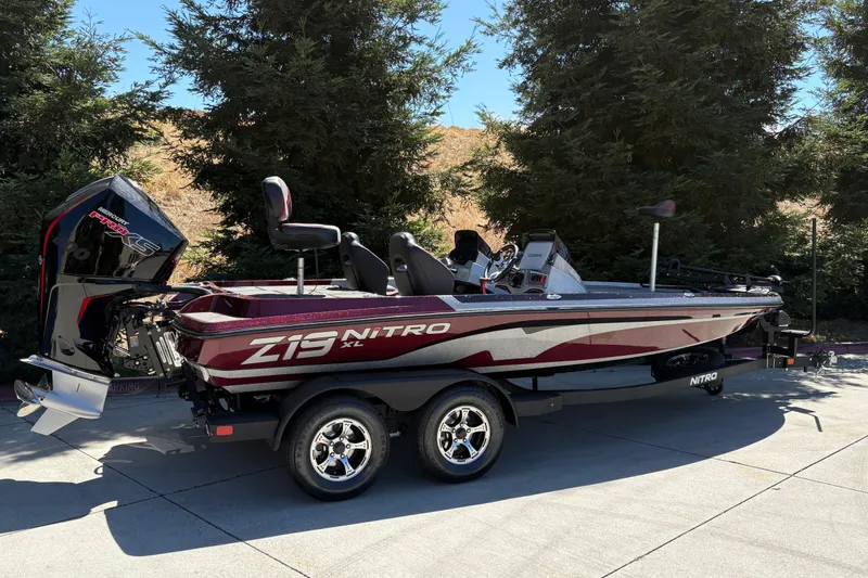 Slide: The Image of 2026 Nitro Z19 XL boat on trailer, parked outdoors, side view. - 3