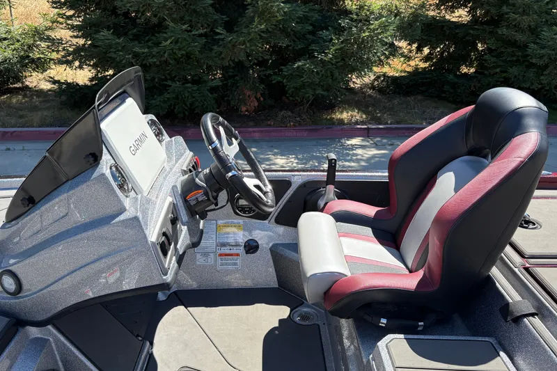 Slide: The Image of 2026 Nitro Z19 XL boat cockpit with Garmin navigation system and comfortable seating. - 21