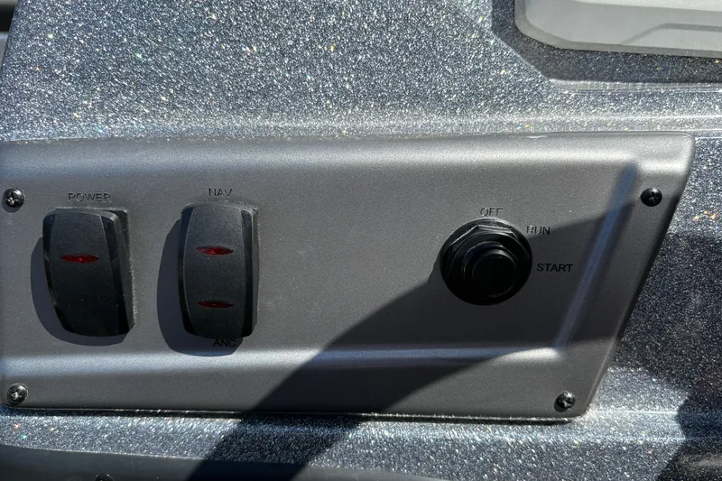 Slide: The Image of Control panel of 2026 Nitro Z19 XL boat with switches and ignition. - 31