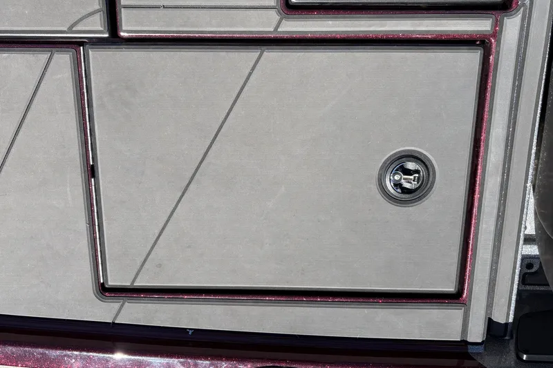 Slide: The Image of 2026 Nitro Z19 XL boat compartment with lock, featuring sleek design and metallic finish. - 26