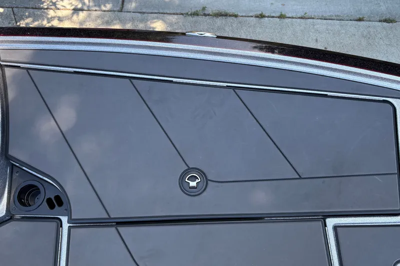 Slide: The Image of 2026 Nitro Z19 XL boat deck with sleek black panels and lock mechanism. - 27