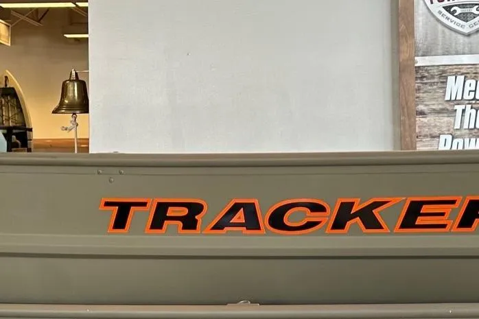 The Image of 2026 Tracker Grizzly 10 Jon boat with bold orange lettering. - 0