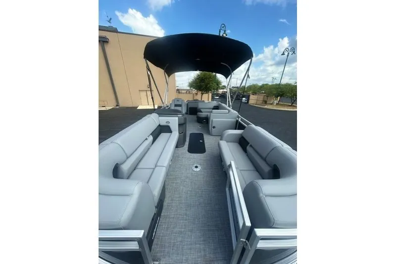 Slide: The Image of 2026 Sun Tracker SportFish 22 XP3 pontoon boat with spacious seating and canopy. - 4