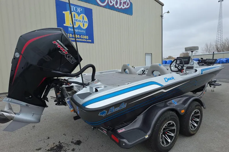 Slide: The Image of 2023 Bass Cat Caracal boat with Mercury Pro XS engine, parked outside dealership. - 3