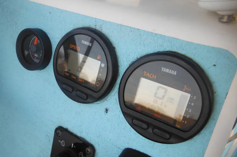 Slide: The Image of Control panel of a 1998 Maritime Skiff 18 with Yamaha gauges. - 18