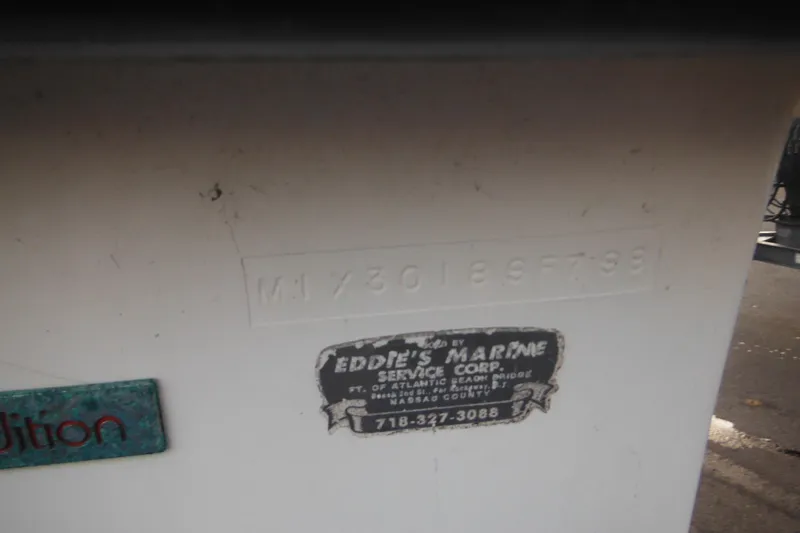 Slide: The Image of 1998 Maritime Skiff 18 with Eddie's Marine Service Corp sticker and serial number. - 3