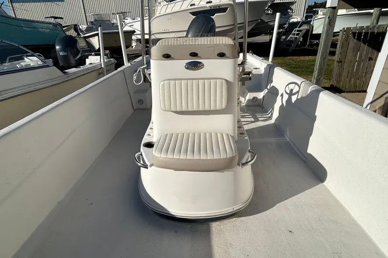 Slide: The Image of 2014 Carolina Skiff 258 DLV boat interior with seating and console. - 8