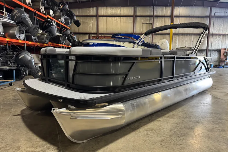 The Image of 2026 Godfrey Sweetwater 2286 SFL pontoon boat in warehouse, showcasing sleek design. - 0