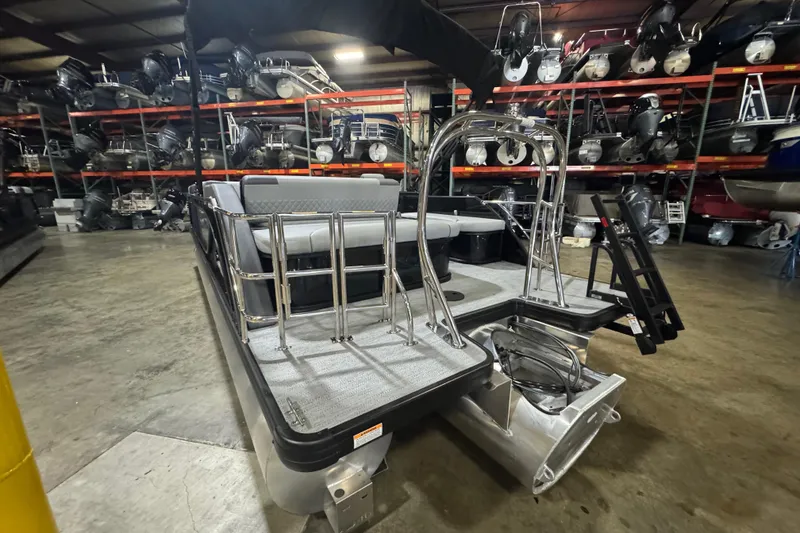 Slide: The Image of 2026 Godfrey Sweetwater 2286 SFL pontoon boat in warehouse, showcasing rear deck and seating. - 13