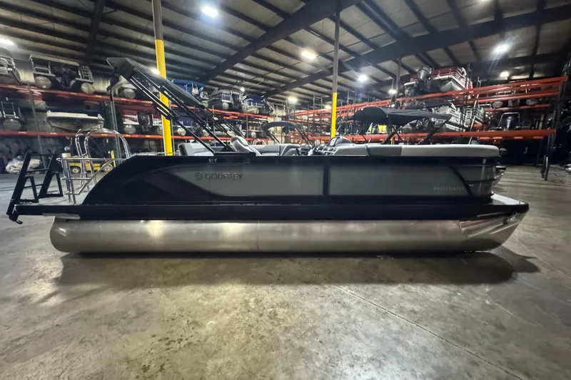Slide: The Image of 2026 Godfrey Sweetwater 2286 SFL pontoon boat in a warehouse setting. - 2