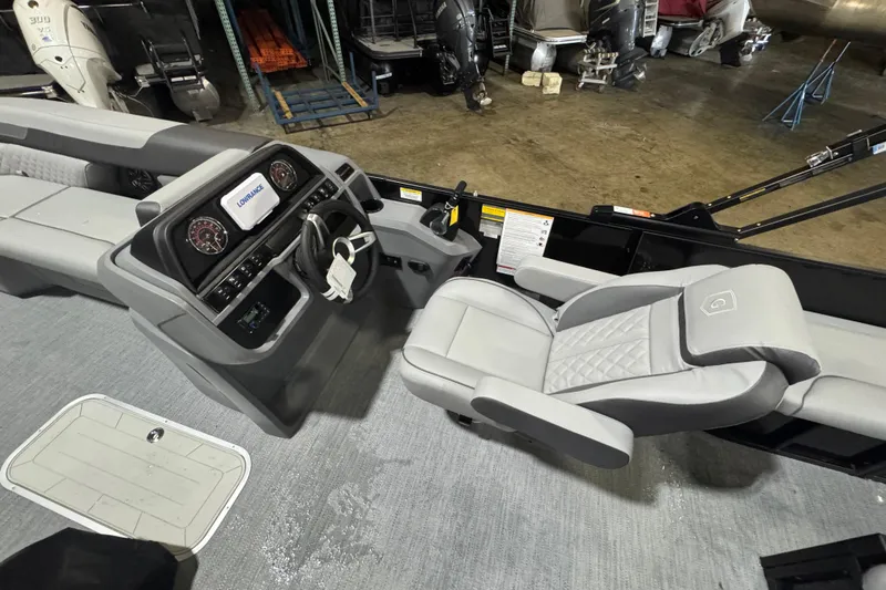 Slide: The Image of 2026 Godfrey Sweetwater 2286 SFL boat interior with steering console and seating. - 8