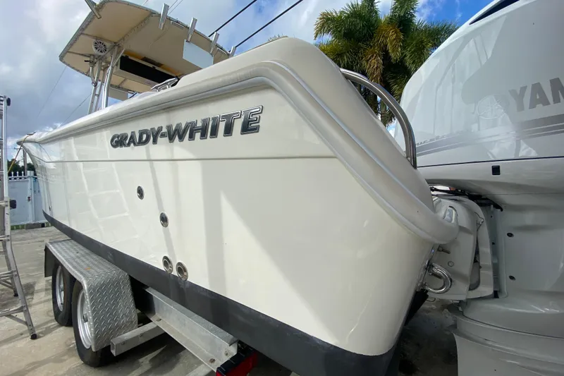 Slide: The Image of 2004 Grady-White Canyon 283 boat on trailer, side view with Yamaha engine. - 15