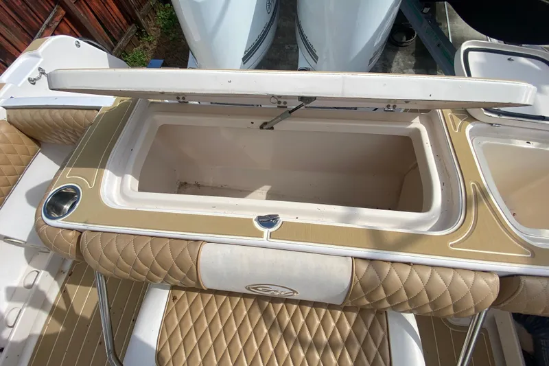 Slide: The Image of Open storage compartment on 2004 Grady-White Canyon 283 boat with quilted seating. - 29