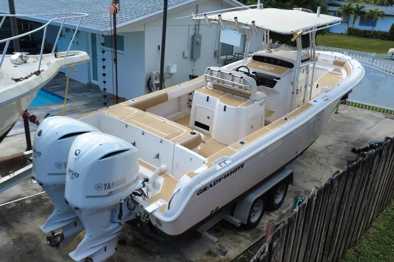 Slide: The Image of 2004 Grady-White Canyon 283 boat with twin Yamaha engines on a trailer. - 3