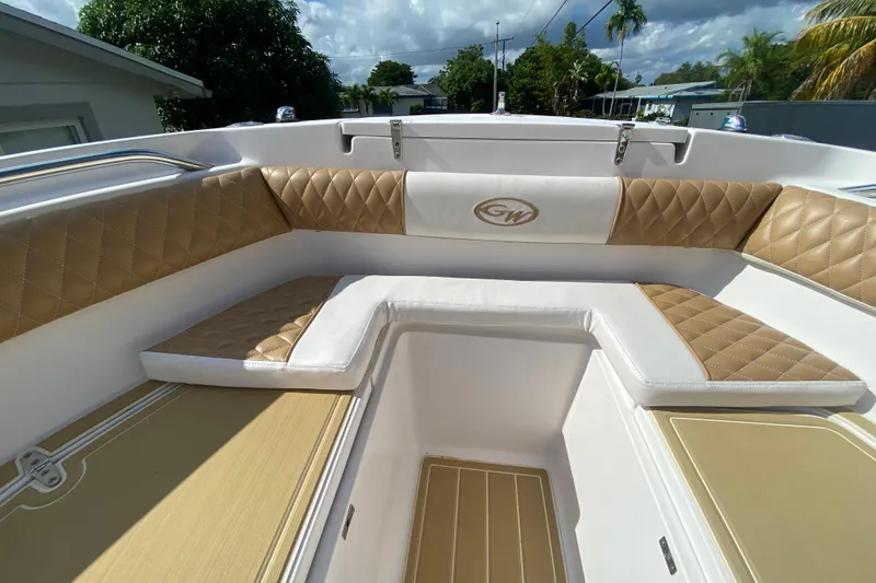Slide: The Image of 2004 Grady-White Canyon 283 boat interior with tan diamond-stitched seating. - 53