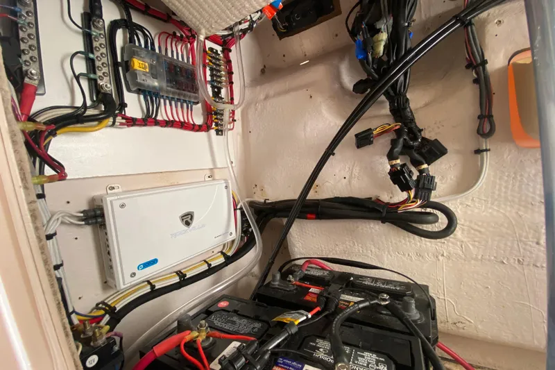 Slide: The Image of Electrical wiring and components inside a 2004 Grady-White Canyon 283 boat. - 61