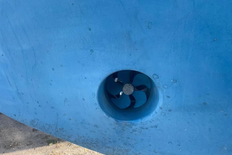 Slide: The Image of 1986 Mainship Mark III Motor Cruiser bow thruster in blue hull. - 20