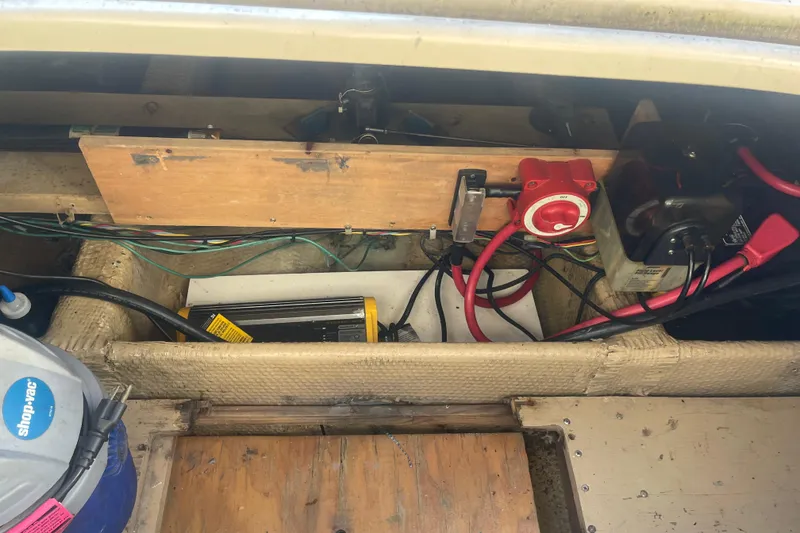 Slide: The Image of 1986 Mainship Mark III Motor Cruiser engine compartment with wiring and battery switch. - 40