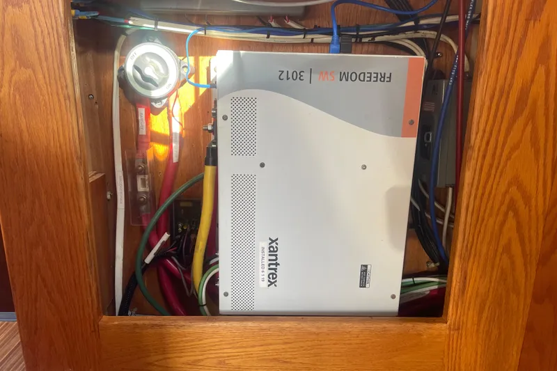 Slide: The Image of Electrical system inside 1986 Mainship Mark III Motor Cruiser with Xantrex Freedom SW 3012 inverter. - 41