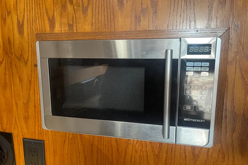 Slide: The Image of Built-in Emerson microwave on Mainship Mark III Motor Cruiser, 1986 model. - 45