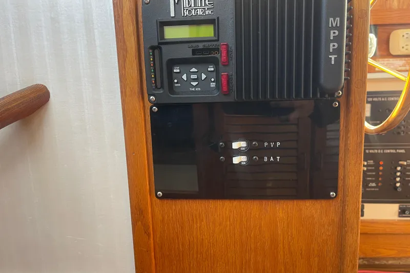 Slide: The Image of Control panel of a 1986 Mainship Mark III Motor Cruiser with solar MPPT system. - 52