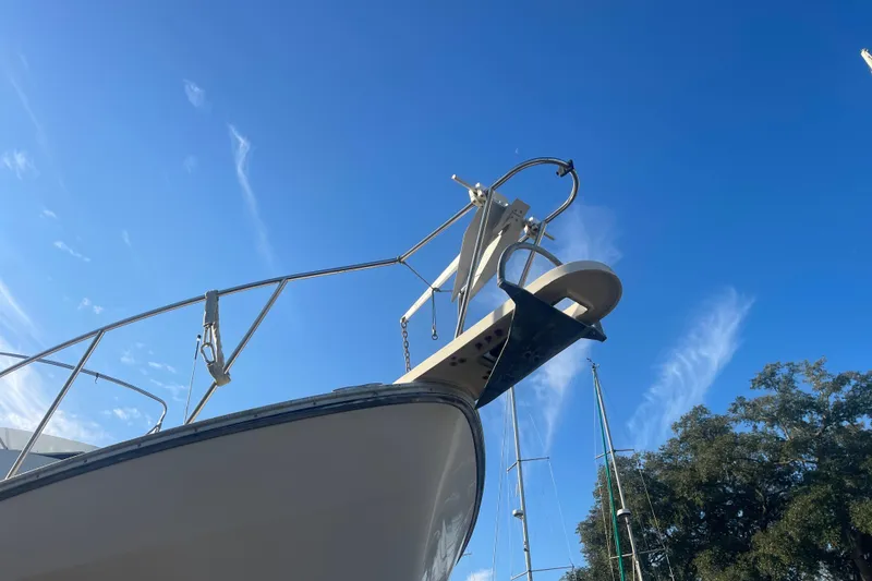 Slide: The Image of 1986 Mainship Mark III Motor Cruiser against clear blue sky. - 7