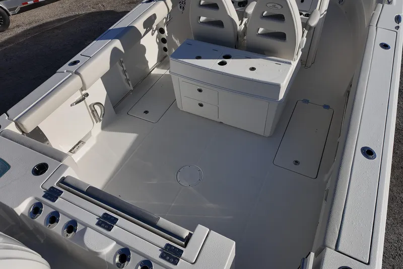 Slide: The Image of 2026 Sailfish 312 CC boat interior with seating and storage compartments. - 15