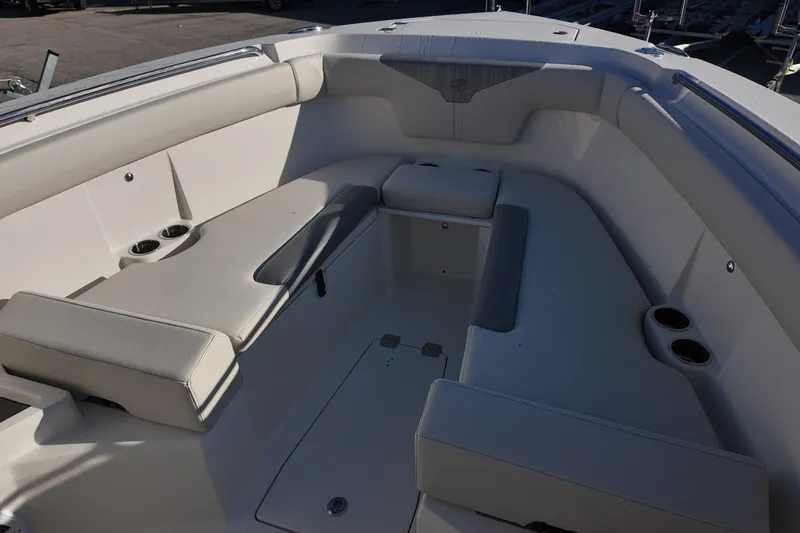 Slide: The Image of 2026 Sailfish 312 CC boat interior with cushioned seating and cup holders. - 22