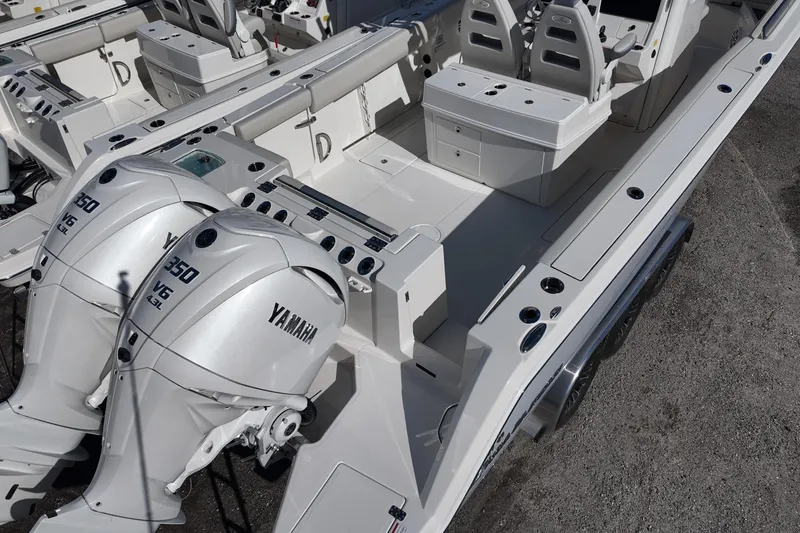 Slide: The Image of 2026 Sailfish 312 CC boat with dual Yamaha 350 engines, spacious deck layout. - 9