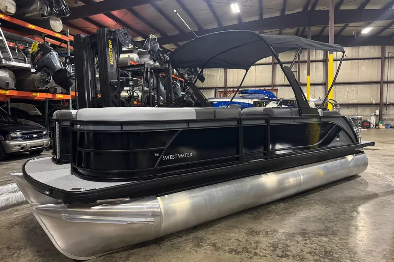 The Image of 2026 Godfrey Sweetwater 2286 SFL pontoon boat in a warehouse setting. - 0