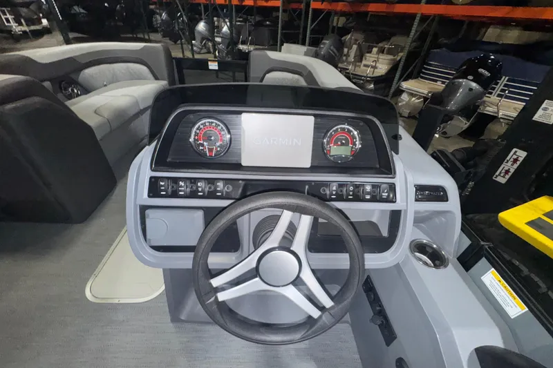 Slide: The Image of 2026 Godfrey Sweetwater 2286 SFL boat dashboard with Garmin display and steering wheel. - 10