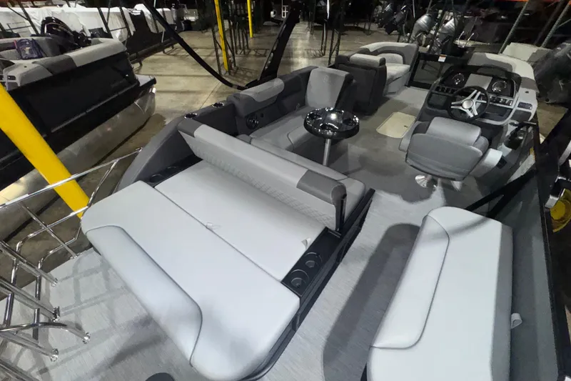 Slide: The Image of 2026 Godfrey Sweetwater 2286 SFL pontoon boat interior with modern seating and helm. - 13