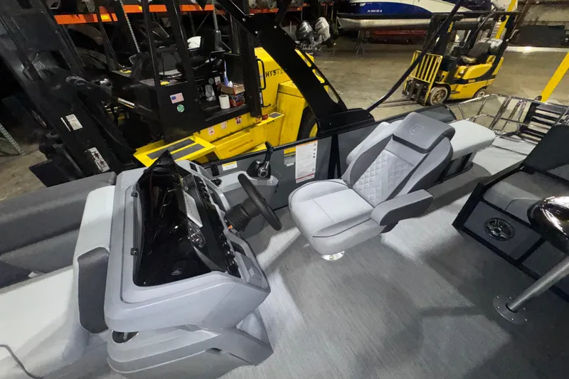 Slide: The Image of Interior of 2026 Godfrey Sweetwater 2286 SFL boat with modern seating and controls. - 9