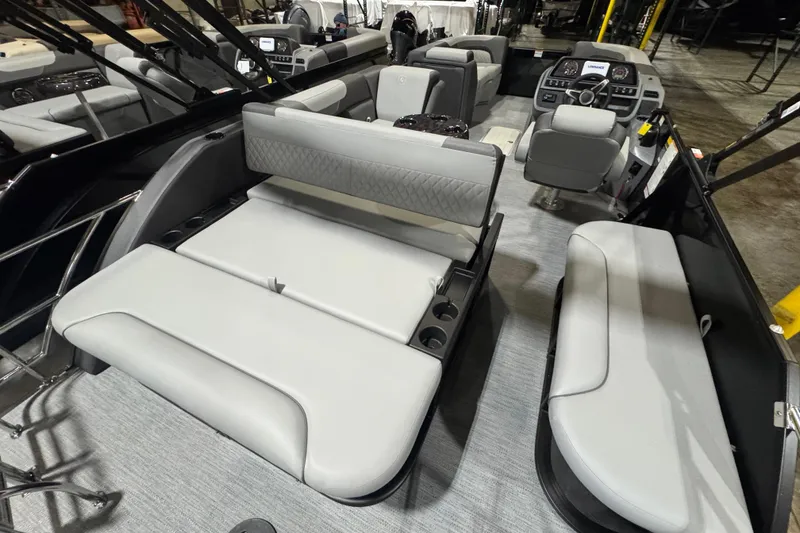 Slide: The Image of 2026 Godfrey Sweetwater 2286 SFL pontoon boat interior with modern seating and helm. - 10