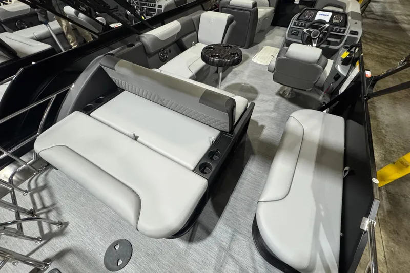 Slide: The Image of 2026 Godfrey Sweetwater 2286 SFL boat interior with modern seating and steering console. - 9