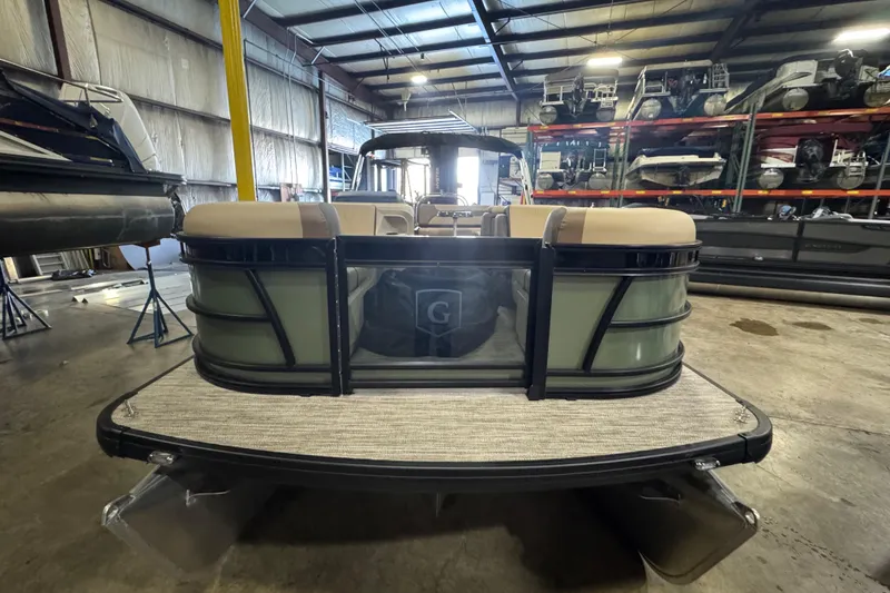 Slide: The Image of 2026 Godfrey Sweetwater 2286 SFL pontoon boat in a showroom, rear view. - 2