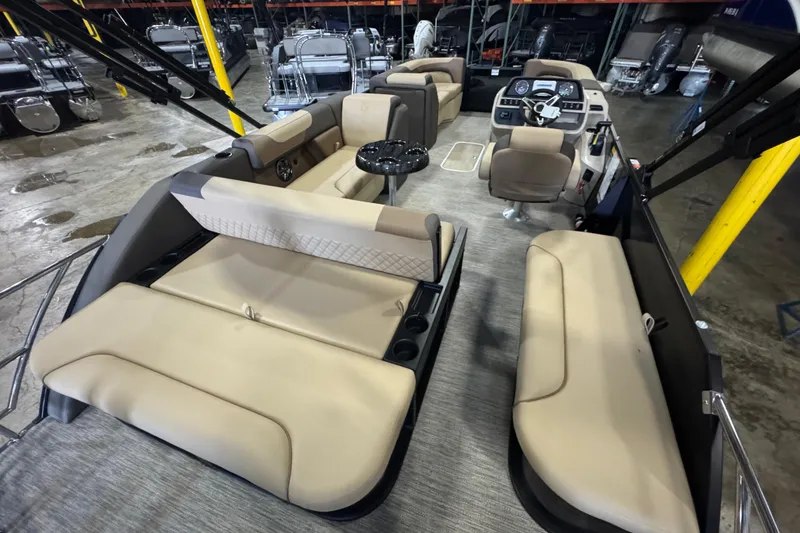 Slide: The Image of 2026 Godfrey Sweetwater 2286 SFL pontoon boat interior with beige seating and modern dashboard. - 8