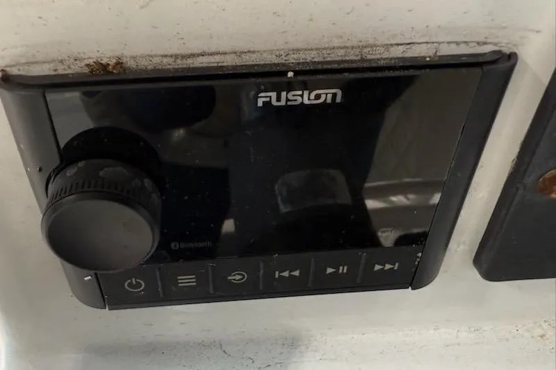 Slide: The Image of Control panel of a Fusion audio system in a 2002 Monza 26 boat. - 13