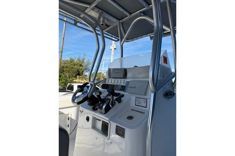 Slide: The Image of 2002 Monza 26 boat console with steering wheel and navigation equipment. - 2