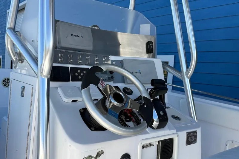 Slide: The Image of 2002 Monza 26 boat console with Garmin navigation system and steering wheel. - 3