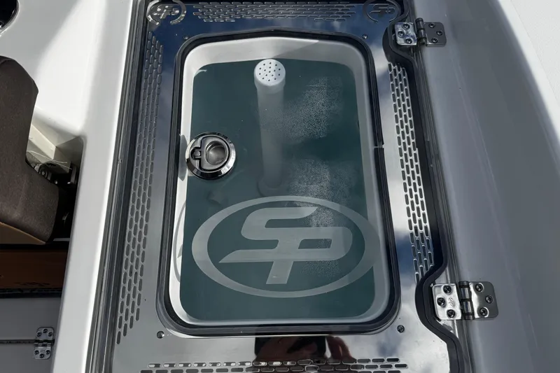 Slide: The Image of Livewell on 2026 Sea Pro 292 DLX boat with logo and water. - 12