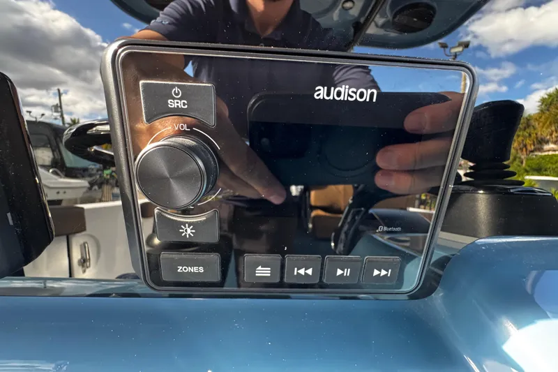 Slide: The Image of 2026 Sea Pro 292 DLX audio control panel with Audison interface and Bluetooth connectivity. - 21